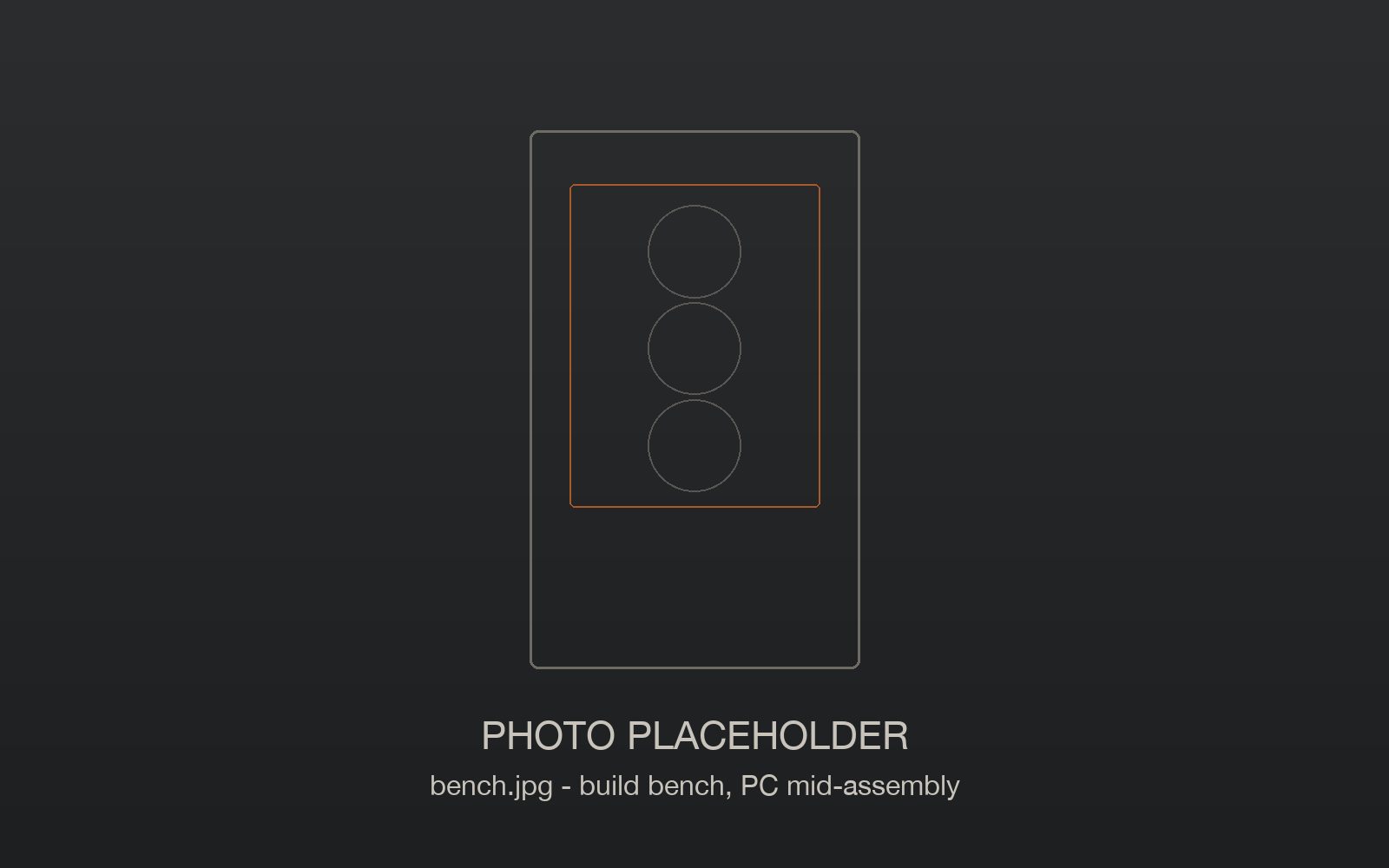 The Frame Foundry build bench with tools and a PC mid-assembly